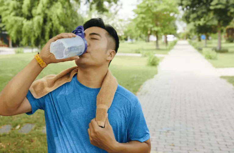 man drinking water