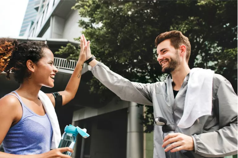 healthy employees exercising to reduce health risks