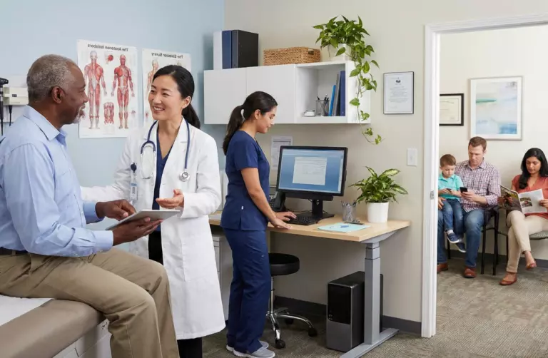 man at annual well visit with doctor