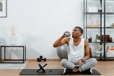 person drinking water for hydration